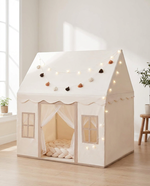 Cream house-shaped play tent in a bright living room