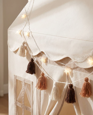 Scalloped valance, star lights and tassel garland detail